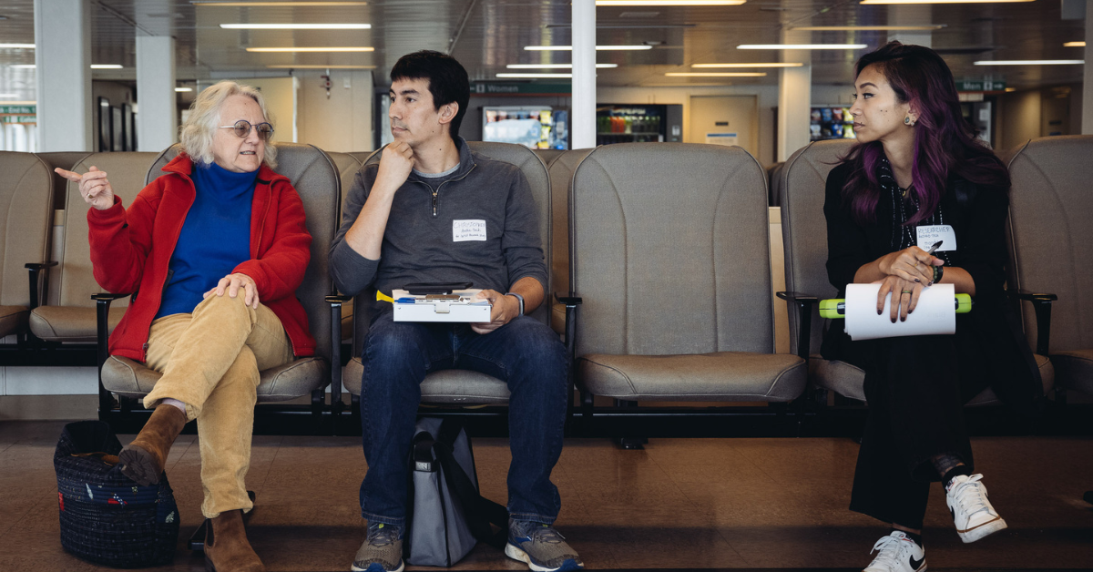 Anthro-Tech researchers conducting an interview with a passenger on a Washington State Ferry for an accessibility audit.